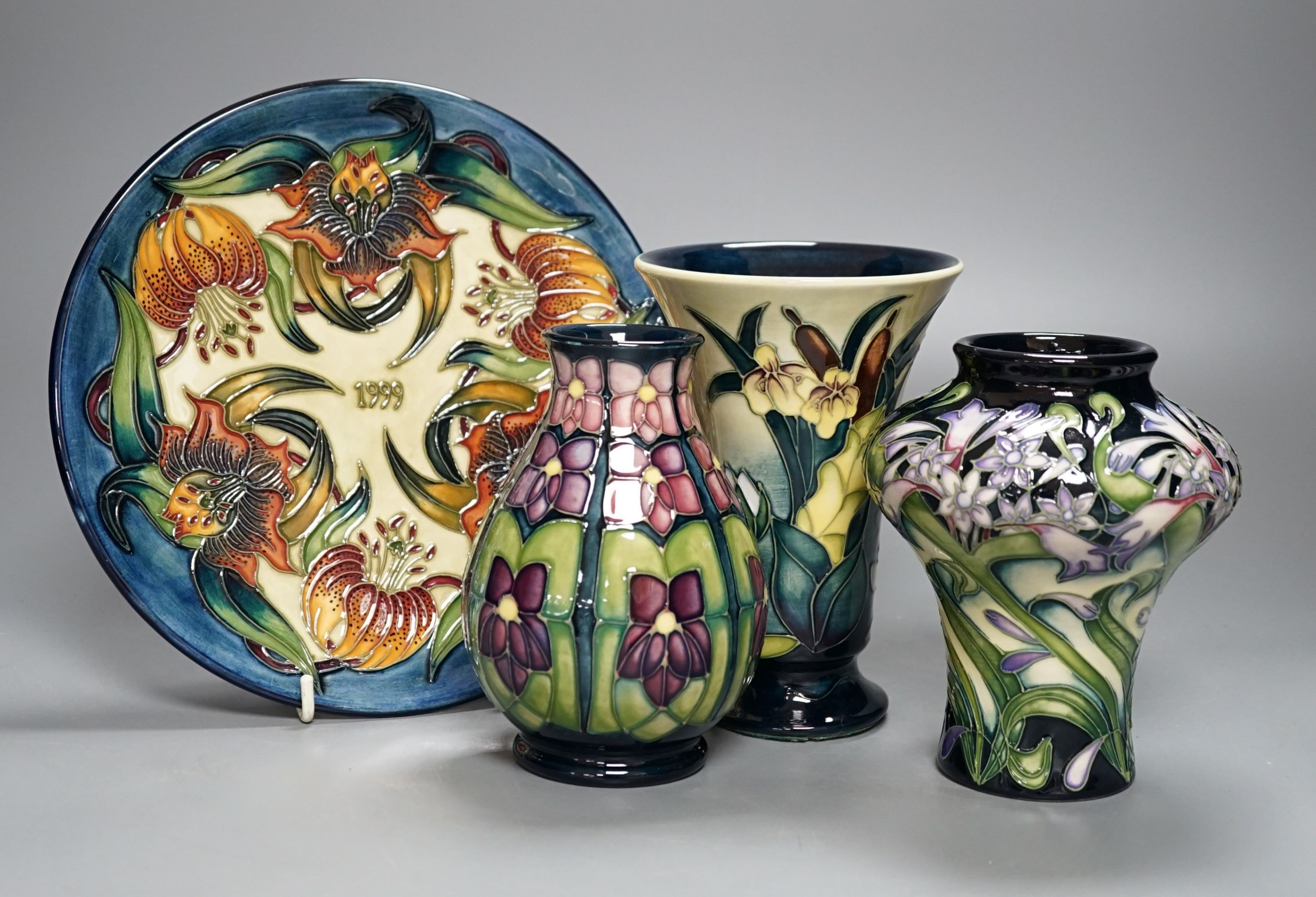 Three modern Moorcroft vases, tallest 15.5 cm and a plate 22 cm